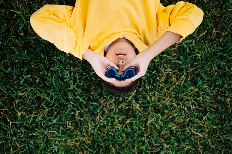 Kid looking through binoculars